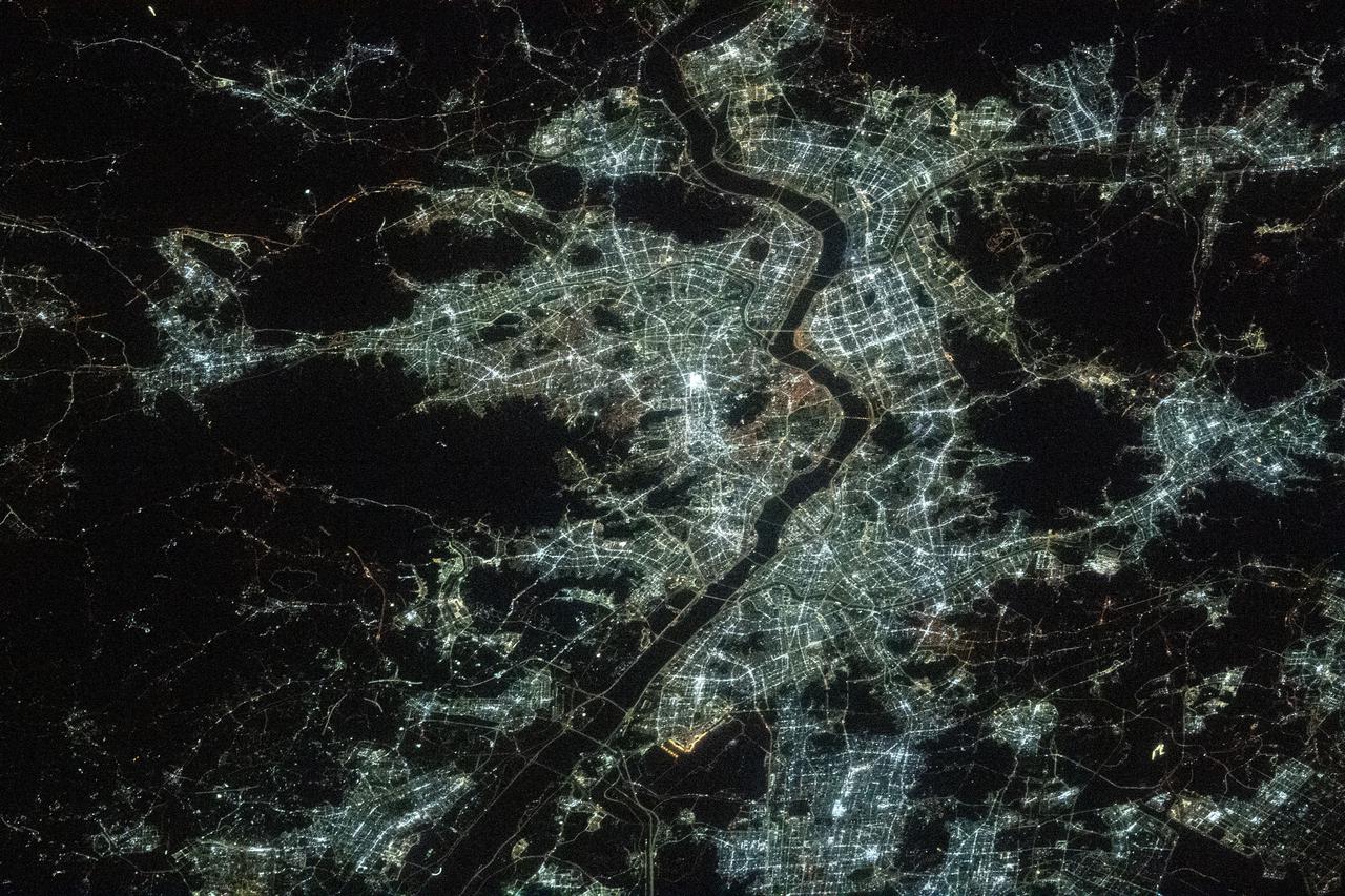 iss066e158841 (March 8, 2022) --- Seoul, the capital of South Korea, split by the Han River, is pictured during an orbital night pass from the International Space Station at an altitude of 264 miles above the Sea of Japan.