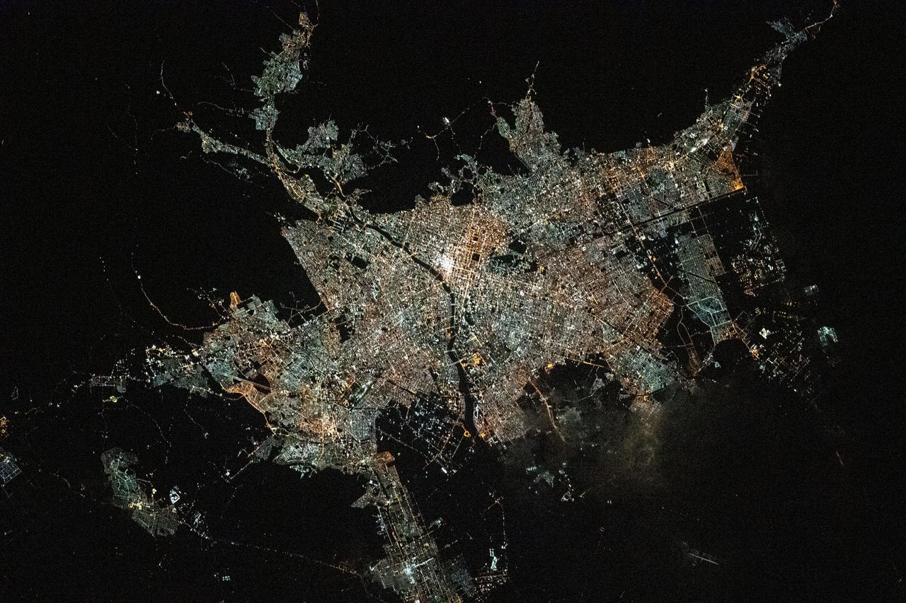 iss066e158950 (March 8, 2022) --- Sapporo, the capital of Japan's northern island of Hokkaido, split by the Toyohira River, is pictured during an orbital night pass from the International Space Station at an altitude of 264 miles above the Sea of Japan.