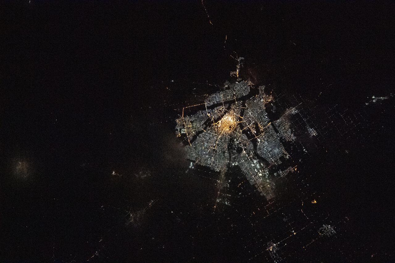 iss066e158964 (March 8, 2022) --- The city of Asahikawa, on Japan's northern island of Hokkaido, is pictured during an orbital night pass from the International Space Station at an altitude of 264 miles above the Sea of Japan.
