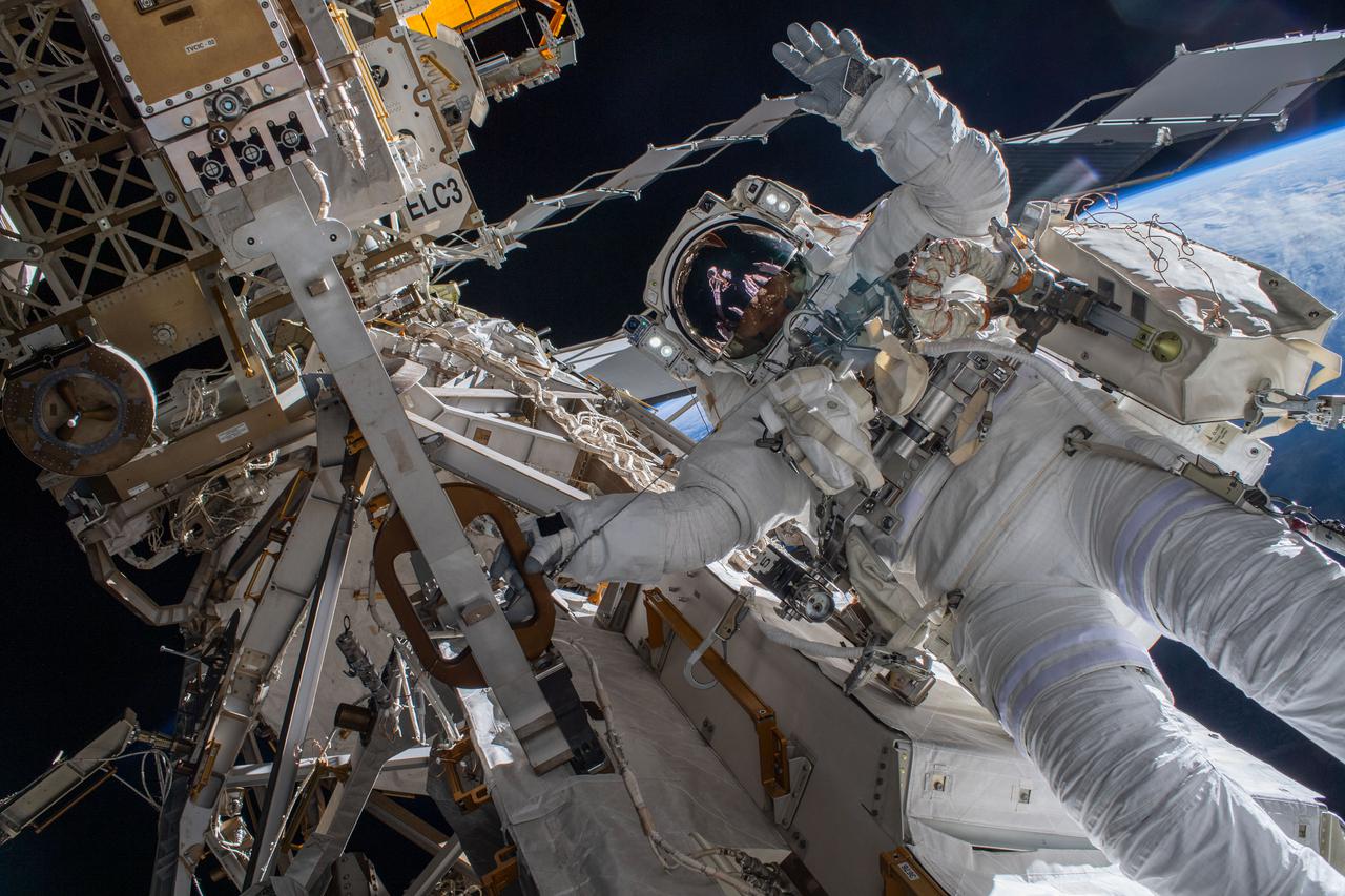 iss066e174224 (March 23, 2022) --- Astronaut Matthias Maurer of ESA (European Space Agency) is pictured on the International Space Station's truss structure during a spacewalk to install thermal gear and electronics components on the orbiting lab.