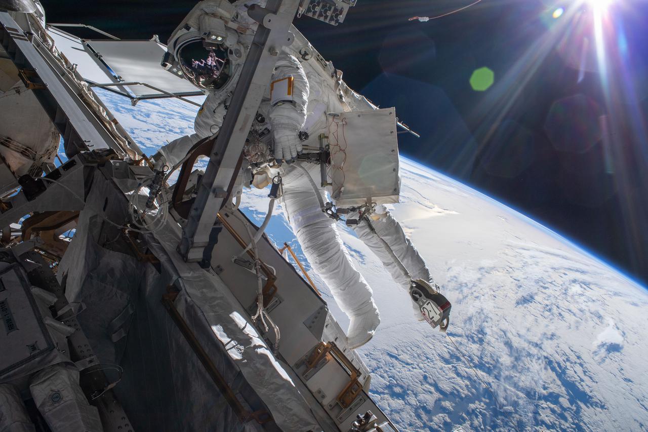 iss066e174257 (March 23, 2022) --- Astronaut Matthias Maurer of ESA (European Space Agency) is pictured on the International Space Station's truss structure during a spacewalk to install thermal gear and electronics components on the orbiting lab. The space station was 268 miles above the Pacific Ocean off the coast of New Zealand.