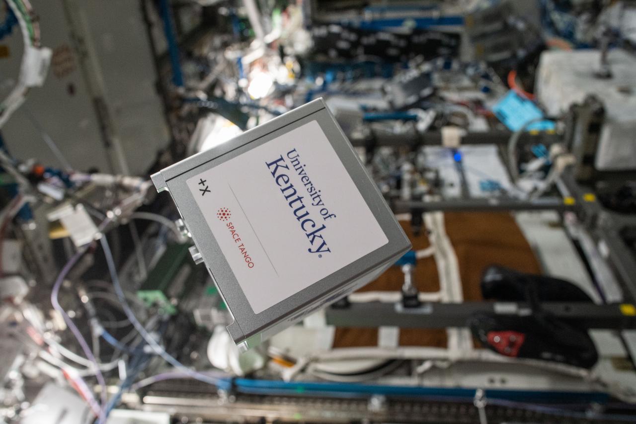 iss067e000411 (3/31/2022) --- A view of a Cube containing Space Tango - Cubelab Satellite Demonstrator, part of TangoLab Mission-25 aboard the International Space Station (ISS). Space Tango - University of Kentucky Cubelab Satellite Demonstrator (Space Tango - Cubelab Satellite Demonstrator) tests a new attitude-control technology for small satellites, which is an integral part of future space missions.