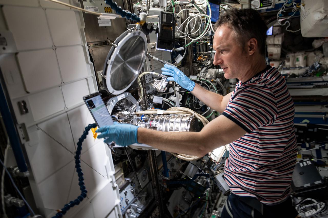 iss067e003161 (April 5, 2022) --- ESA (European Space Agency) astronaut and Expedition 67 Flight Engineer Matthias Maurer performs maintenance on combustion research hardware aboard the International Space Station.