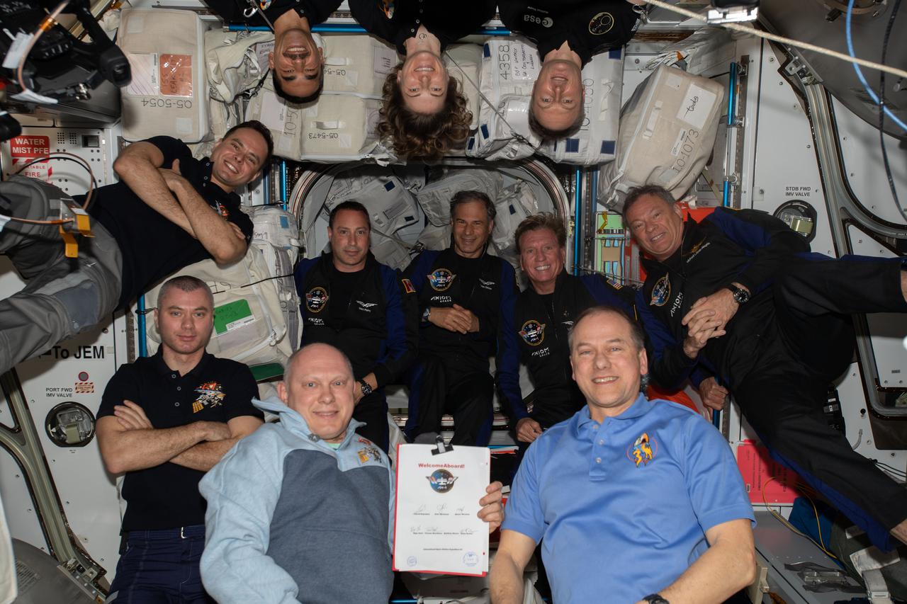 iss067e006334 (April 9, 2022) --- The 11-person crew aboard the station comprises of (clockwise from bottom right) Expedition 67 Commander Tom Marshburn with Flight Engineers Oleg Artemyev, Denis Matveev, Sergey Korsakov, Raja Chari, Kayla Barron, and Matthias Maurer; and Axiom Mission 1 astronauts (center row from left) Mark Pathy, Eytan Stibbe, Larry Conner, and Michael Lopez-Alegria.