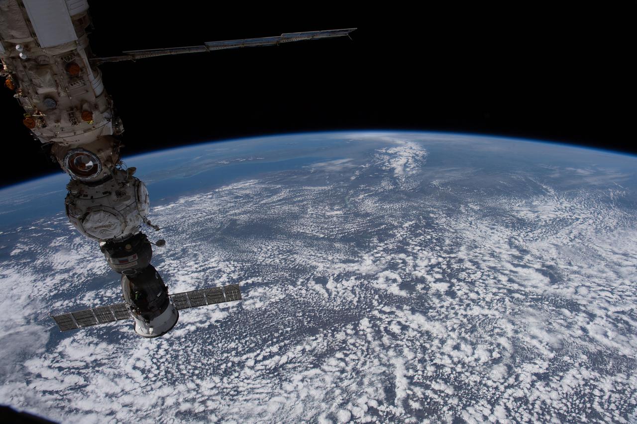 iss067e007920 (April 11, 2022) --- At bottom right, is the Soyuz MS-21 crew ship docked to the Prichal module, which is itself docked to the Nauka multipurpose laboratory module attached to the Russian segment of the International Space Station. The orbiting lab was flying 261 miles above Romania at the time this photograph was taken.