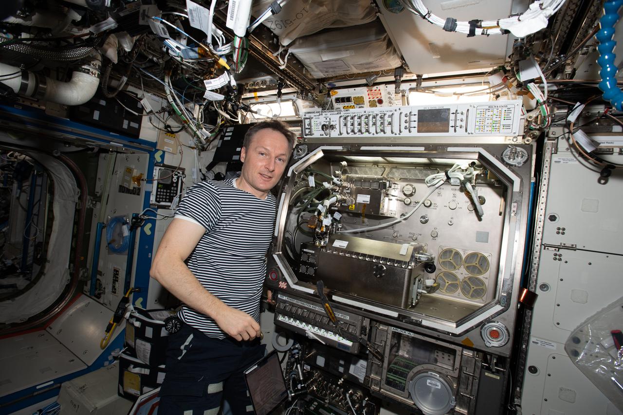 iss067e008088 (April 10, 2022) --- ESA (European Space Agency) astronaut and Expedition Flight Engineer Matthias Maurer is pictured in front of the Microgravity Science Glovebox located inside the International Space Station's U.S. Destiny laboratory module.
