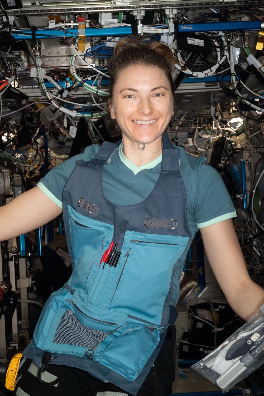 iss067e014525 (April 14, 2022) --- NASA astronaut and Expedition 67 Flight Engineer Kayla Barron poses for a portrait during maintenance work aboard the International Space Station.