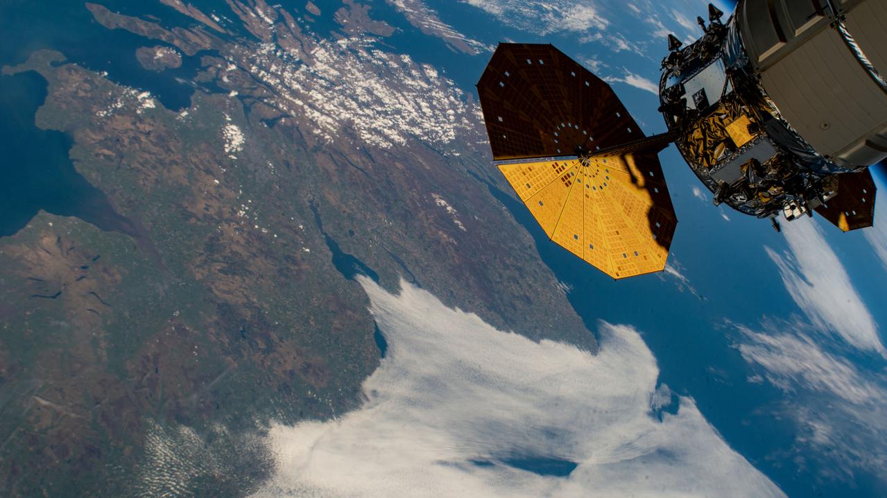 iss067e022350 (April 20, 2022) --- The International Space Station orbits 261 miles above England with Northrop Grumman's Cygnus space freighter pictured in the upper right foreground.