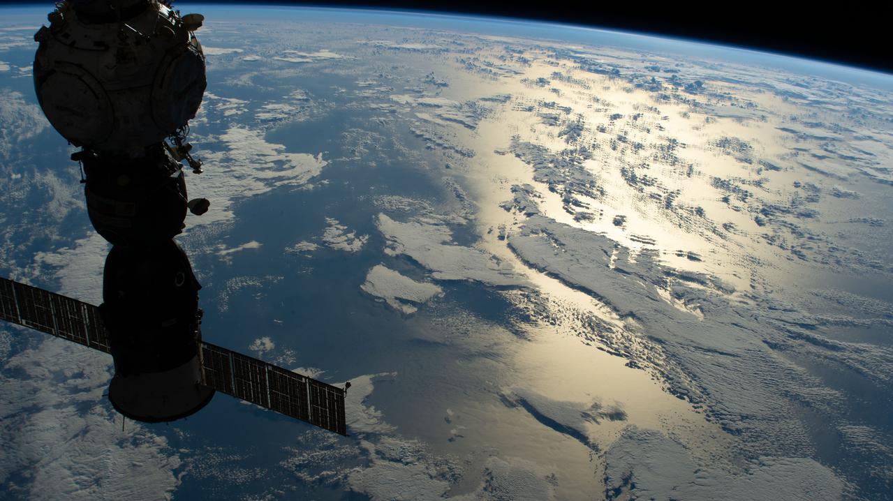 iss067e029147 (April 23, 2022) --- The silhouetted Soyuz MS-21 crew ship docked to the Prichal docking module is pictured as the International Space Station orbited 268 miles above the Pacific Ocean off the coast of Chile.