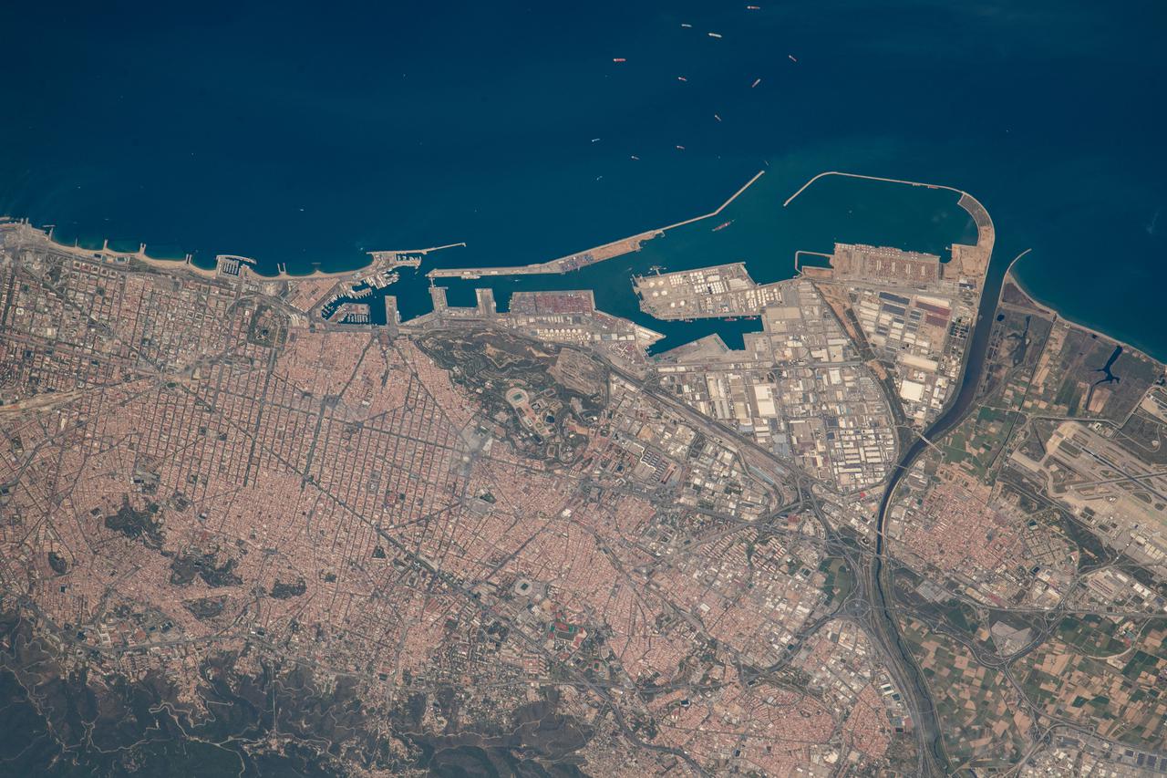 iss067e030640 (April 26, 2022) --- Barcelona, Spain, on the Balaeric Sea coast, is pictured from the International Space Station as it orbited 260 miles above the Mediterranean Sea.