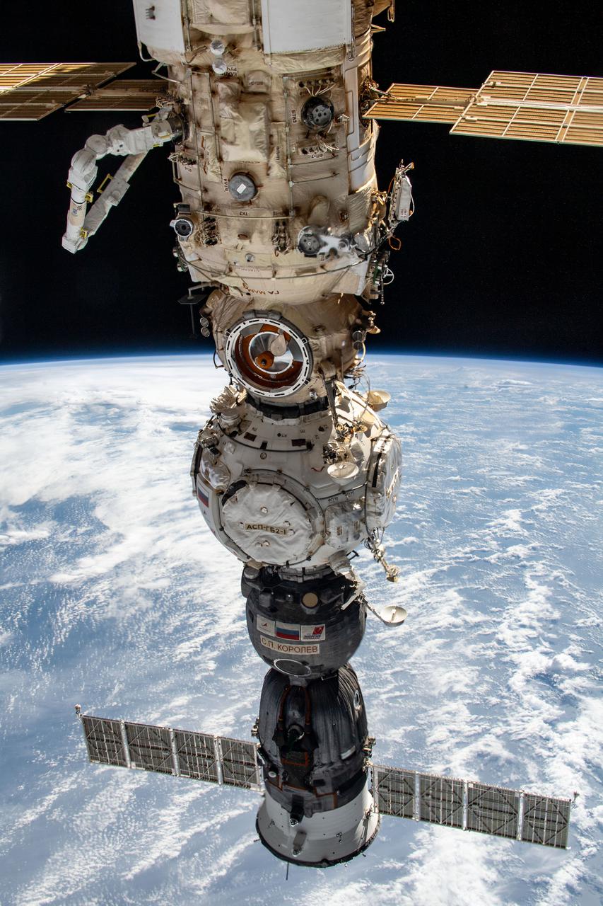 iss067e032335 (April 29, 2022) --- From top to bottom, the Nauka multipurpose laboratory module, the Prichal docking module, and the Soyuz MS-21 crew ship are pictured attached to the Russian segment of the International Space Station. Visible at upper left, is the new European robotic arm attached to Nauka.