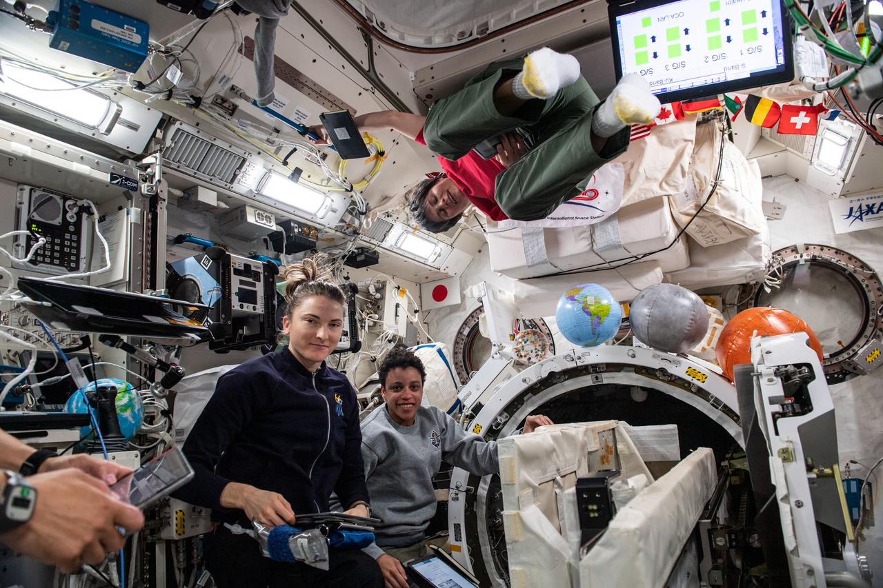 iss067e032353 (April 29, 2022) --- Expedition 67 Flight Engineers Kayla Barron and Jessica Watkins, both from NASA, and Samantha Cristoforetti from ESA (European Space Agency) are pictured checking out systems inside the International Space Station's Kibo laboratory module.