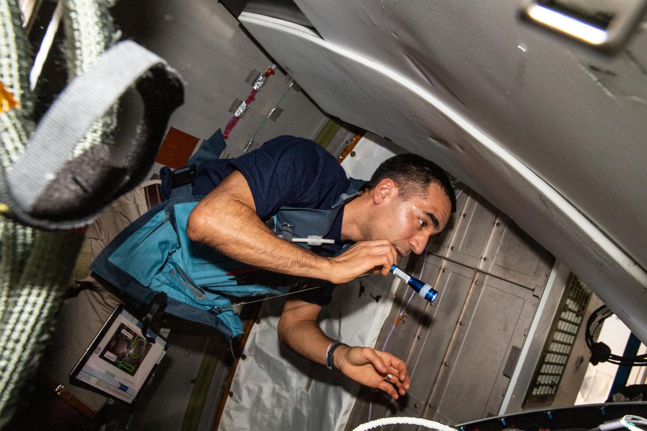 iss067e032373 (April 29, 2022) --- NASA astronaut and Expedition 67 Flight Engineer Raja Chari checks out life support components aboard the International Space Station's Tranquility module.