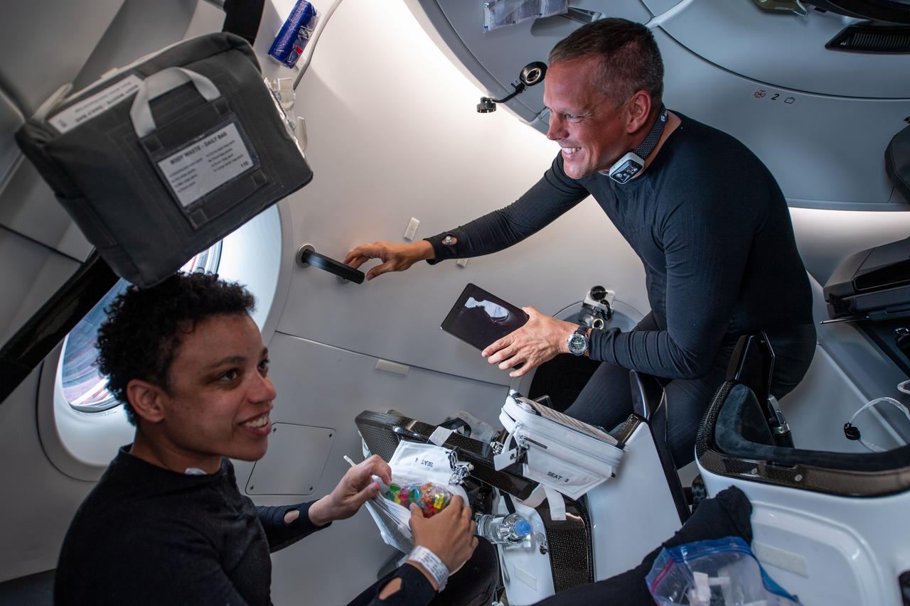iss067e034503 (April 27, 2022) --- NASA astronauts Bob Hines and Jessica Watkins, Crew-4 Pilot and Mission Specialist respectively, are pictured inside the SpaceX Dragon Freedom spacecraft during their journey to the International Space Station.