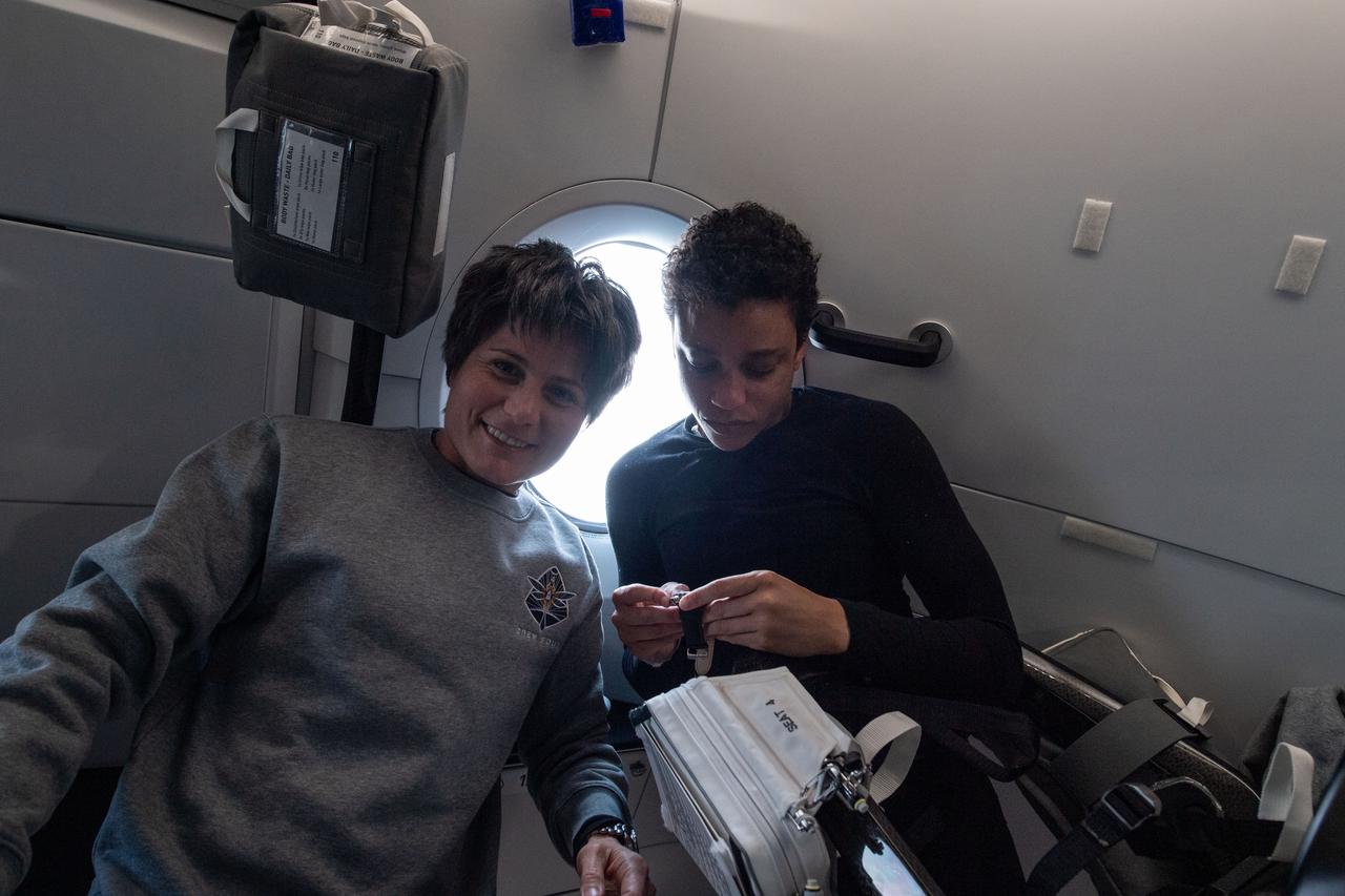 iss067e034527 (April 27, 2022) --- Astronauts (from left) Samantha Cristoforetti of ESA (European Space Agency) and Jessica Watkins of NASA, Crew-4 Mission Specialists, are pictured in front of the SpaceX Dragon Freedom spacecraft’s windows during their journey to the International Space Station.