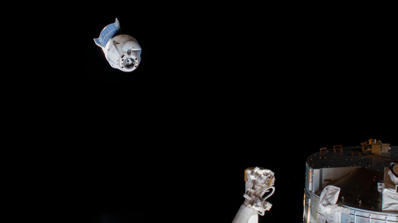 iss067e034663 (May 5, 2021) --- The SpaceX Dragon Endurance crew ship, carrying four Crew-3 astronauts back to Earth, is pictured backing away from the International Space Station following its undocking from the forward port on the Harmony module. Crew-3 Commander Raja Chari led Pilot Tom Marshburn and Mission Specialists Kayla Barron and Matthias Maurer inside Endurance as they reentered Earth's atmosphere and parachuted to a splashdown off the coast of Tampa, Florida, the next day.