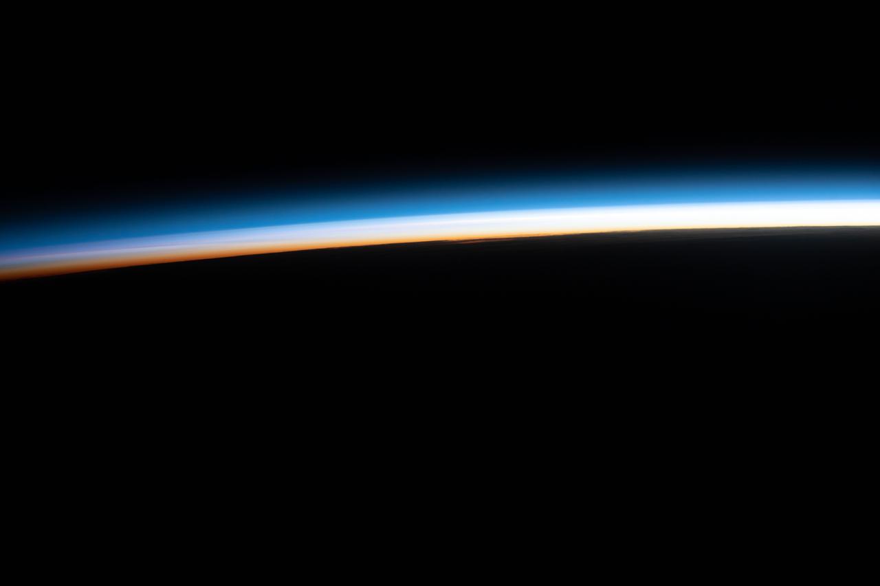 iss067e035797 (May 7, 2022) --- The last rays of an orbital sunset illuminate Earth's horizon in this photograph from the International Space Station as it orbited 267 miles above the Indian Ocean off the coast of Madagascar.