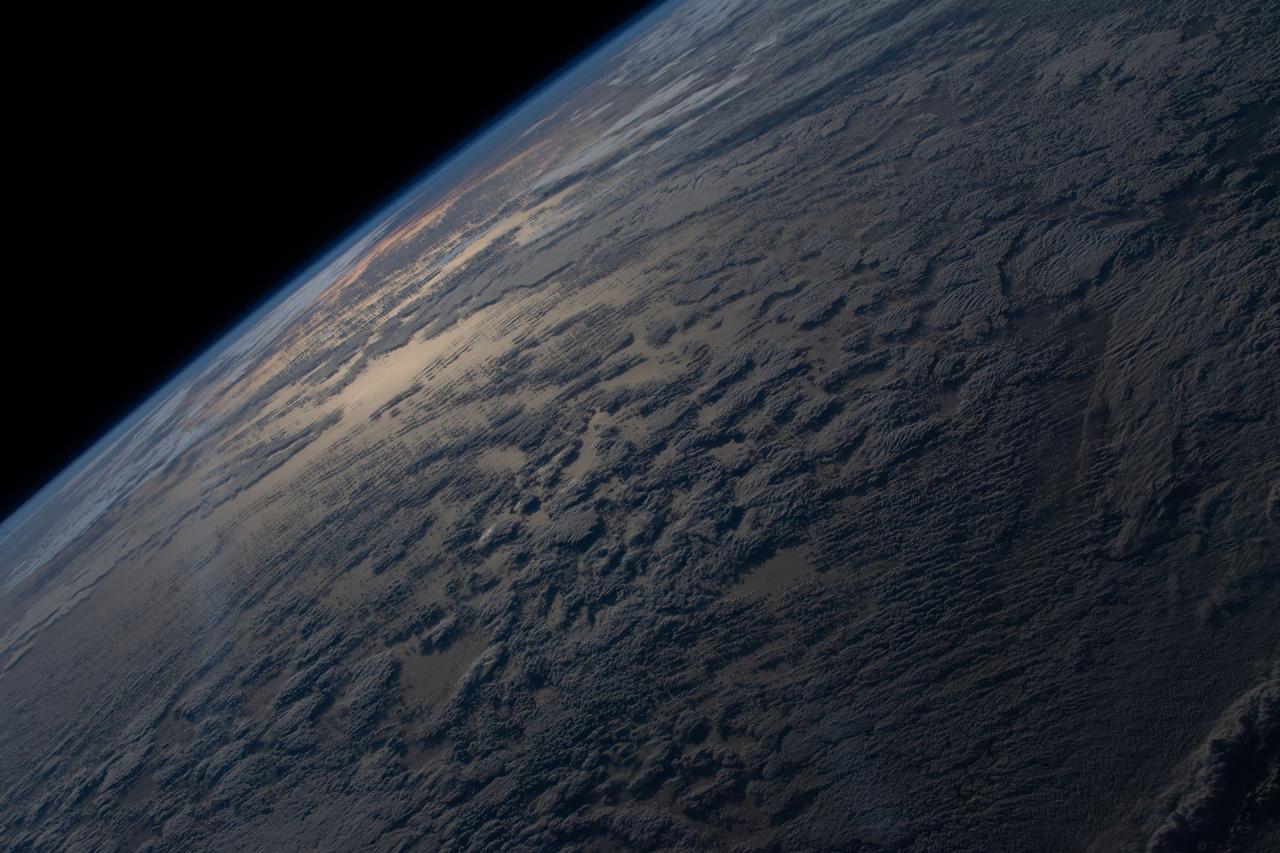 iss067e036267 (May 7, 2022) --- The sun's glint beams off a partly cloudy, southern Atlantic Ocean is this photograph from the International Space Station as it orbited 272 miles above the Earth.