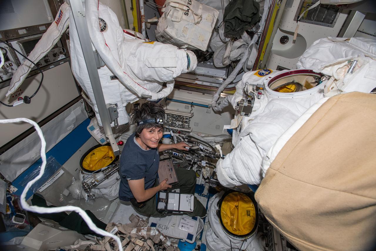 iss067e036364 (May 11, 2022) --- ESA (European Space Agency) astronaut and Expedition 67 Flight Engineer Samantha Cristoforetti works on U.S. spacesuits inside the International Space Station's Quest airlock.