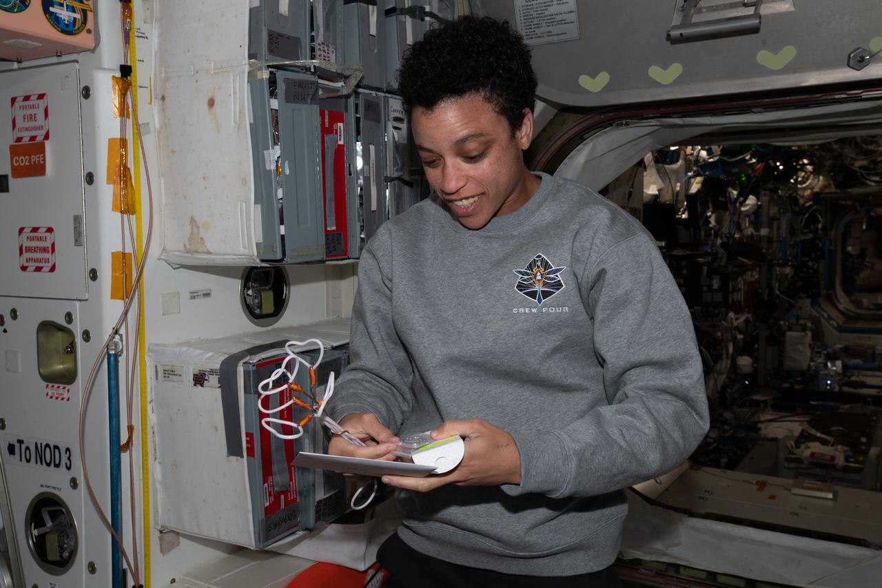iss067e043342 (May 14, 2022) --- NASA astronaut and Expedition 67 Flight Engineer Jessica Watkins checks out gifts she received for her 34th birthday aboard the International Space Station.