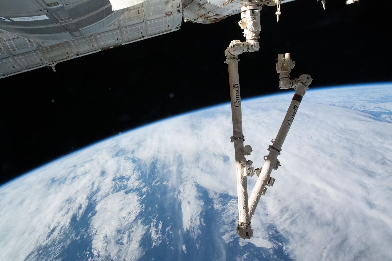 iss067e044014 (May 12, 2022) --- The 57.7-foot-long Canadarm2 is attached to the International Space Station's Harmony module extending into a folded position 271 miles above the Indian Ocean south of Australia's island state of Tasmania.