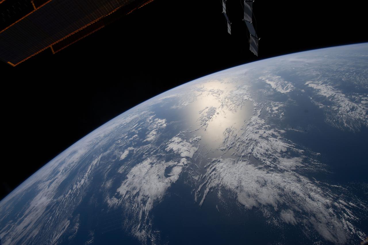 iss067e059659 (May 17, 2022) --- The sun's glint beams off the Atlantic Ocean off the coast of Angola as the International Space Station orbited 264 miles above.
