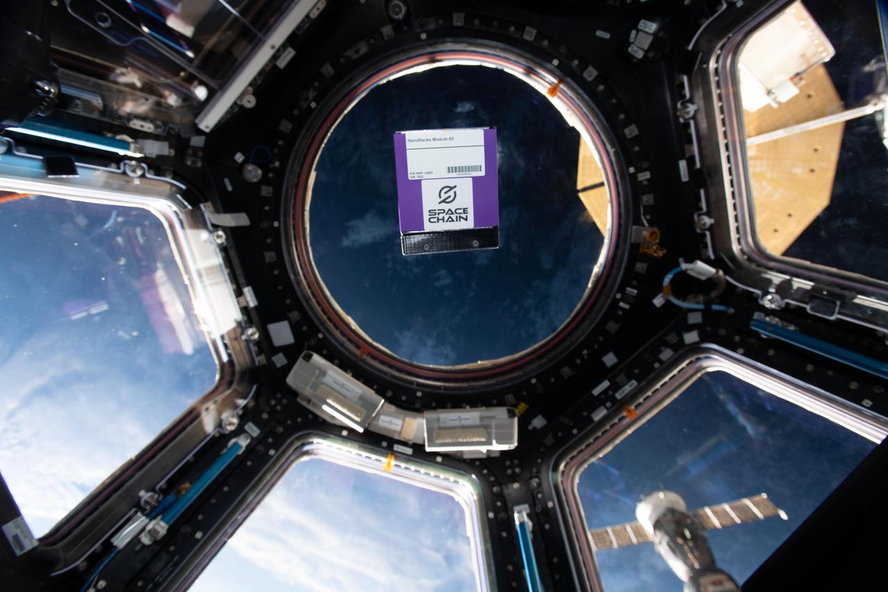 iss067e066379 (5/23/2022) --- A view of the SpaceChain 2.0 investigation in the cupola module aboard the International space Station (ISS). The SpaceChain 2.0 investigation verifies the hardware and software required to extend robust blockchain capabilities into the developing space economy.