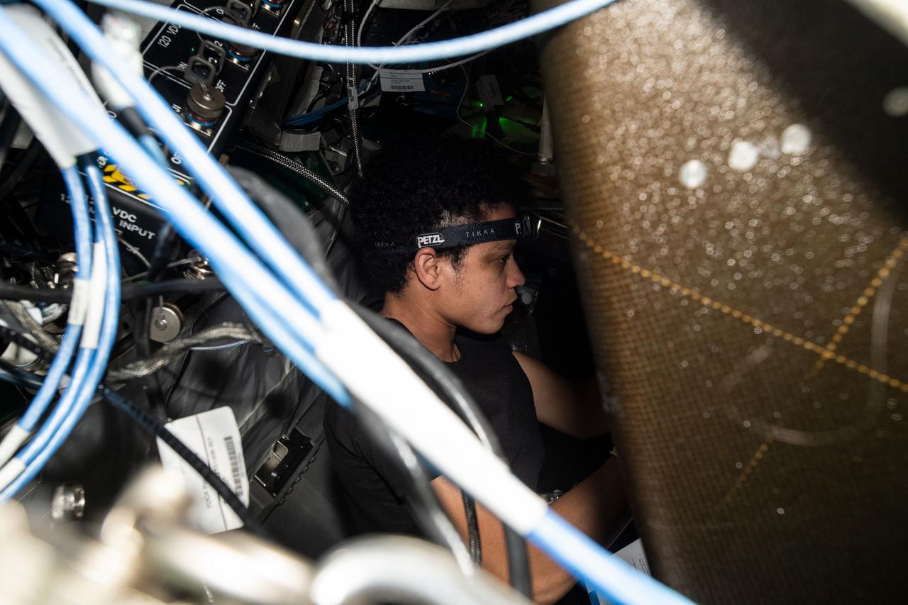 iss067e099400 (June 1, 2022) --- NASA astronaut and Expedition 67 Flight Engineer Jessica Watkins performs maintenance inside the Tranquility module's Waste and Recycling System abaord the International Space Station.