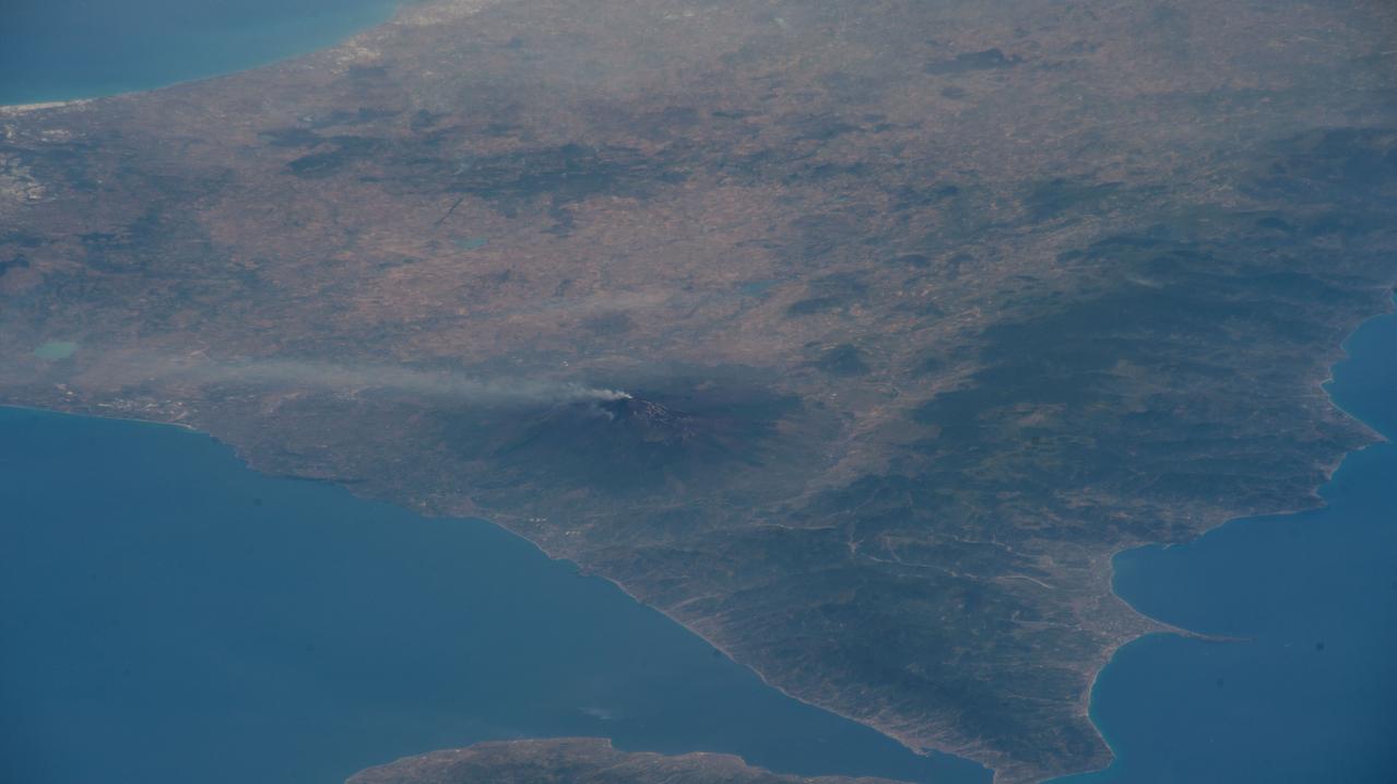 iss067e107088 (June 2, 2022) --- Mount Etna, Europe's tallest active volcano on the coast of Italy's island of Sicily, is pictured billowing with activity as the International Space Station orbited 263 miles above Bulgaria.