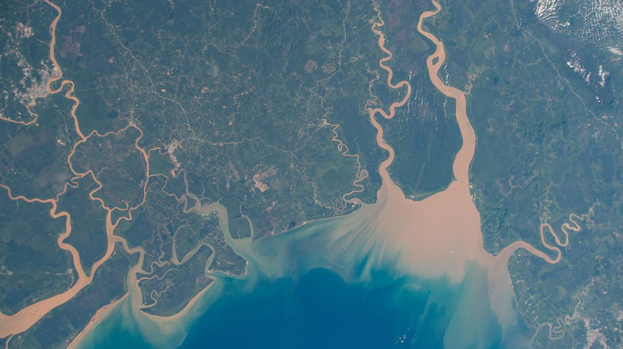 iss067e119830 (June 7, 2022) --- Maludam National Park in East Malaysia is composed of low-lying forests and several rivers that empty into the South China Sea. The International Space Station was orbiting 261 miles above the Maludam Peninsula when this photograph was taken.