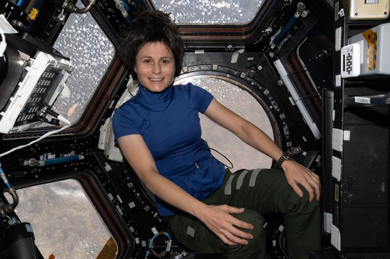 iss067e119939 (June 8, 2022) --- ESA (European Space Agency) astronaut and Expedition 67 Flight Engineer Samantha Cristoforetti is pictured inside the seven-windowed cupola, the International Space Station's "window to the world," while orbiting 264 miles above Kazakhstan.