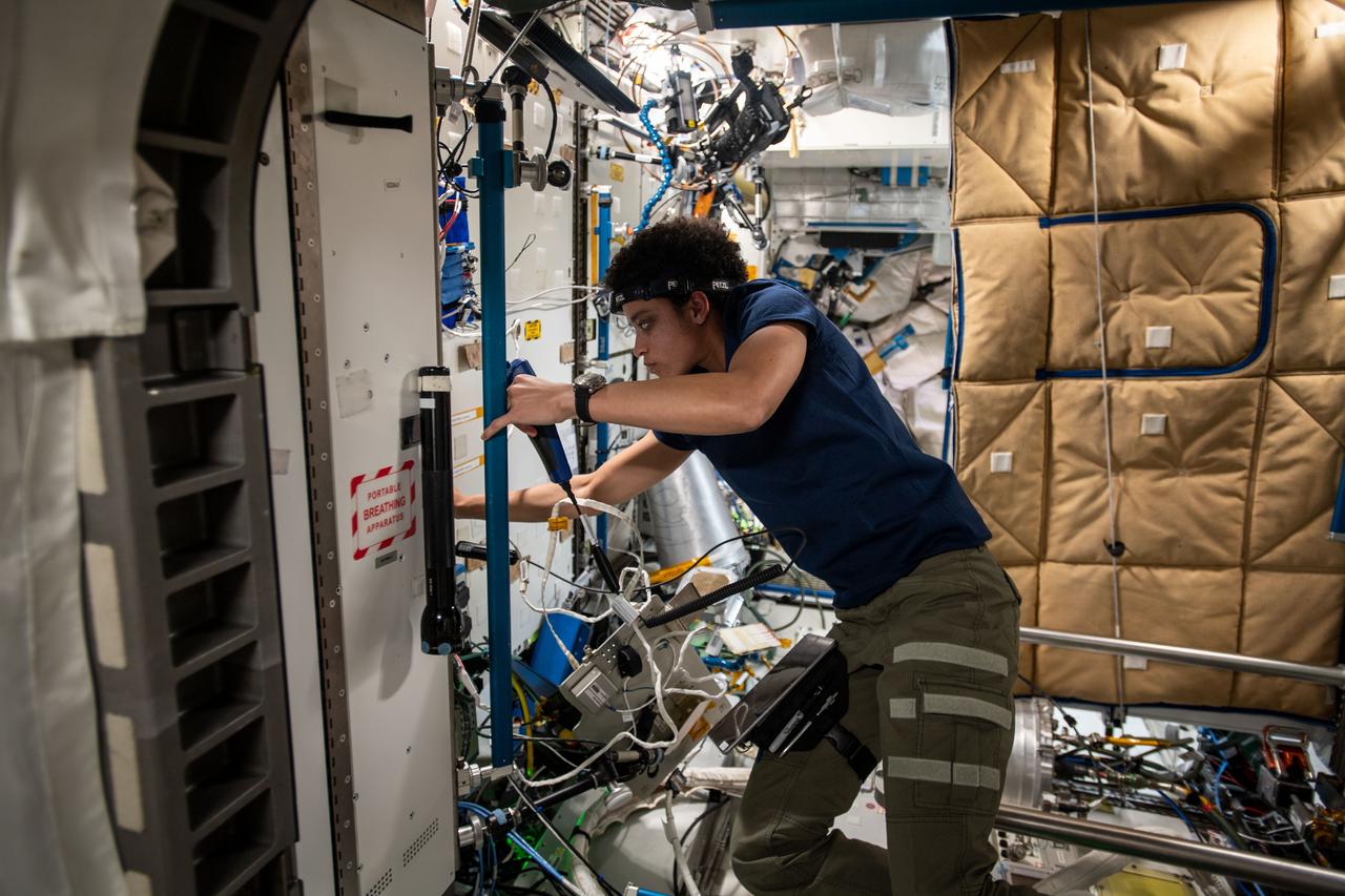 iss067e122957 (June 9, 2022) --- NASA astronaut and Expedition 67 Flight Engineer Jessica Watkins is pictured during maintenance operations inside the International Space Station's Tranquility module.
