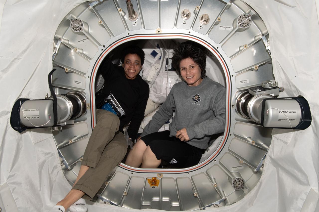 iss067e124526 (June 10, 2022) --- Expedition 67 Flight Engineers (from left) Jessica Watkins of NASA and Samantha Cristoforetti of ESA (European Space Agency) are pictured inside the Bigelow Expandable Activity Module (BEAM) during cargo stowage activities.