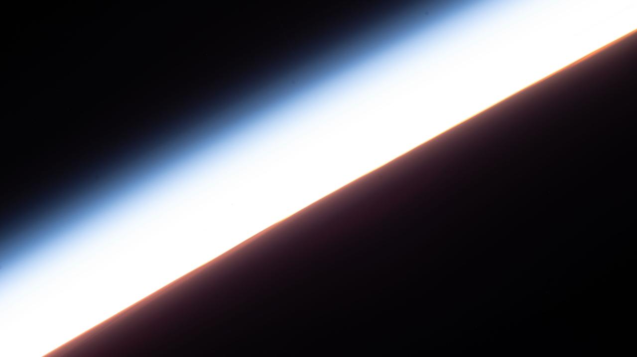 iss067e141214 (June 20, 2022) --- An orbital sunset is pictured from the International Space Station as it was soaring 267 miles above the south Pacific Ocean.