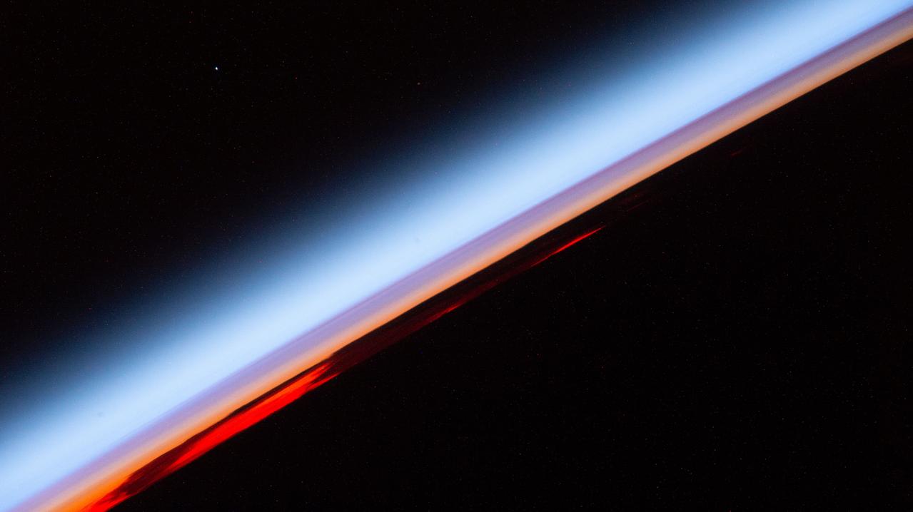 iss067e141215 (June 20, 2022) --- An orbital sunset is pictured from the International Space Station as it was soaring 267 miles above the south Pacific Ocean.
