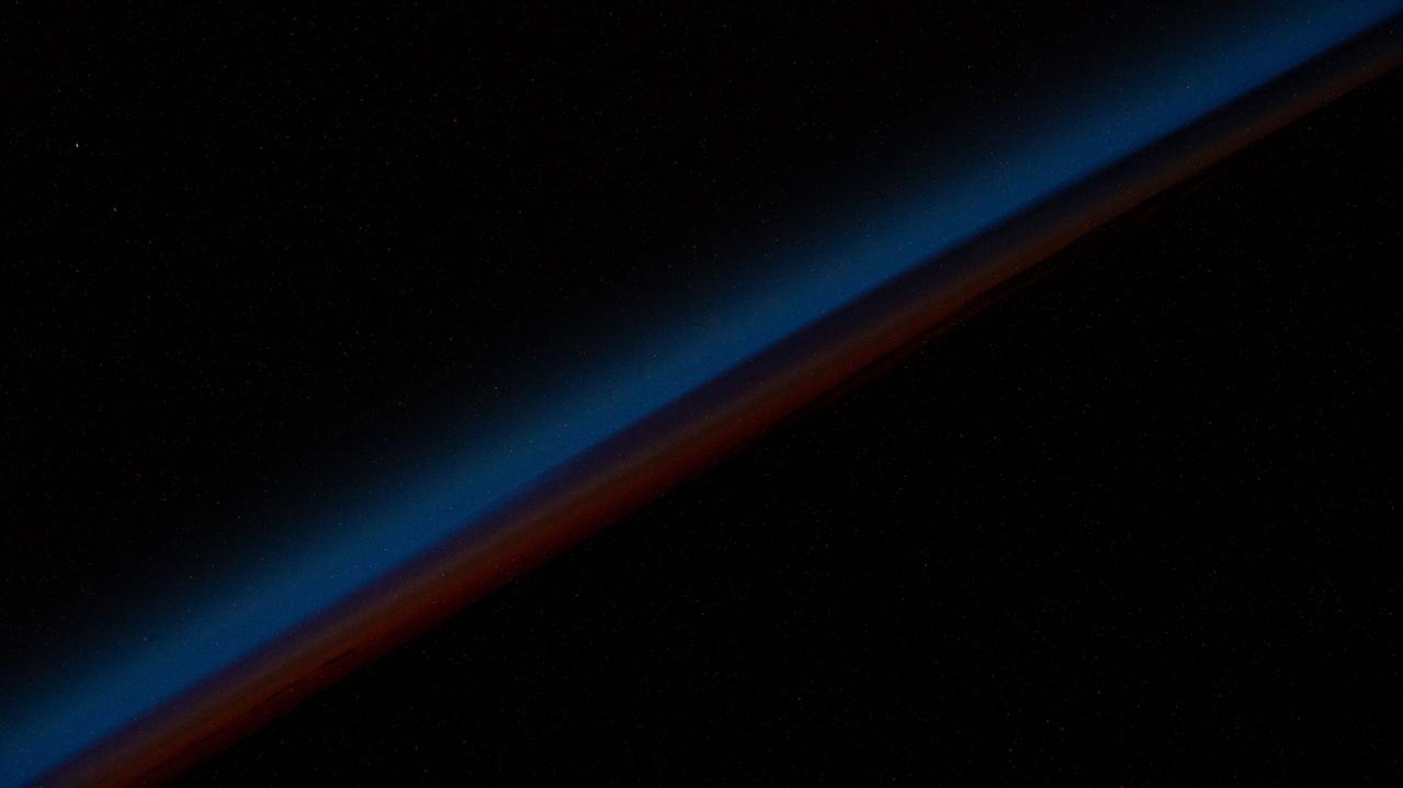 iss067e141217 (June 20, 2022) --- An orbital sunset is pictured from the International Space Station as it was soaring 267 miles above the south Pacific Ocean.