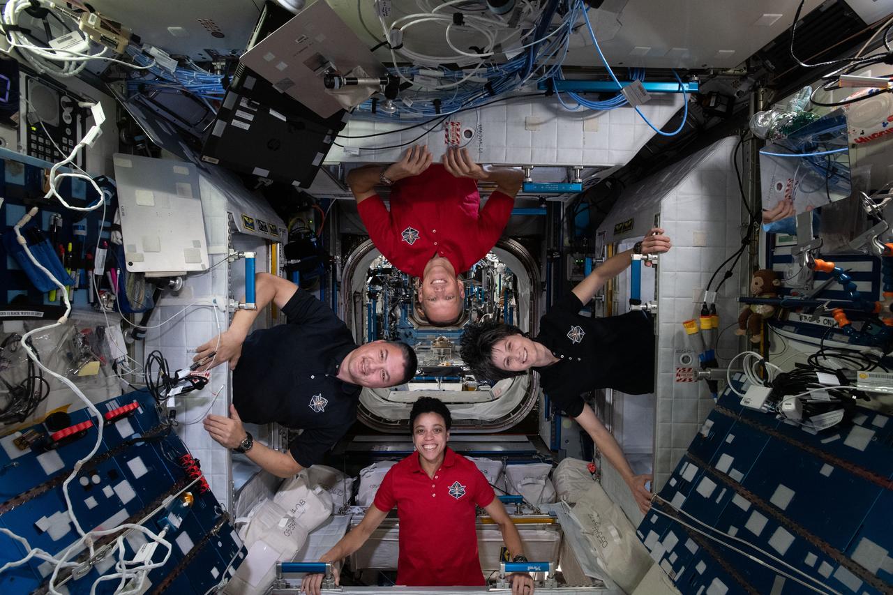 iss067e170650 (July 2, 2022) --- Expedition 67 Flight Engineers (clockwise from bottom) Jessica Watkins, Kjell Lindgren, and Bob Hines, all from NASA, and Samantha Cristoforetti of ESA (European Space Agency), pose for a fun portrait inside their individual crew quarters aboard the International Space Station.
