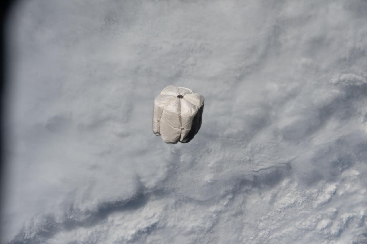 iss067e173472 (July 3, 2022) --- A trash container is pictured on a trajectory away from the International Space Station and toward the Earth's atmosphere for a fiery, but safe disposal. The trash container had been jettisoned moments earlier from the Nanoracks Bishop Airlock while attached to the Canadarm2 robotic arm.