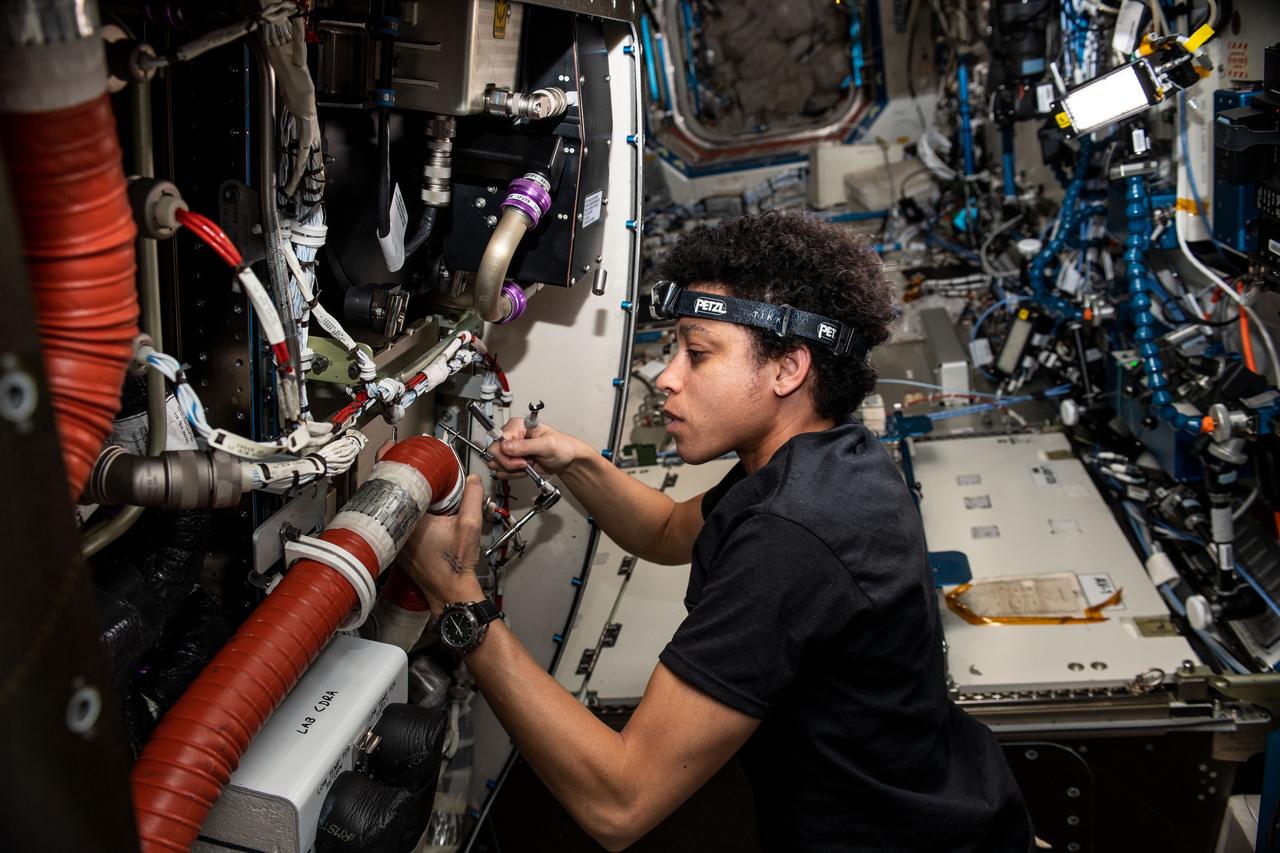 iss067e184982 (July 12, 2022) --- Expedition 67 Flight Engineer and NASA astronaut Jessica Watkins replaces components on the Major Constituents Analyzer, a life support device in the U.S. Destiny laboratory module, that ensures oxygen and carbon dioxide levels remain safe aboard the International Space Station.