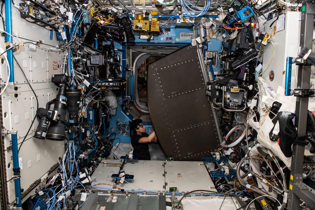iss067e184990 (July 12, 2022) --- Expedition 67 Flight Engineer and NASA astronaut Jessica Watkins replaces components on the Major Constituents Analyzer (MCA) in the U.S. Destiny laboratory module's Avionic Rack. The MCA is a life support device ensures oxygen and carbon dioxide levels remain safe aboard the International Space Station.