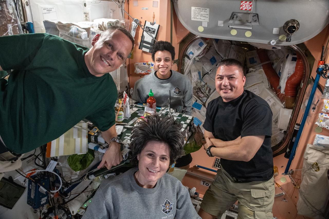 iss067e185046 (July 11, 2022) --- (Clockwise from left) Expedition 67 Flight Engineers Bob Hines, Jessica Watkins, and Kjell Lindgren, all from NASA, and Samantha Cristoforetti from ESA (European Space Agency), pose for a portrait during dinner time in the Unity module of the International Space Station.