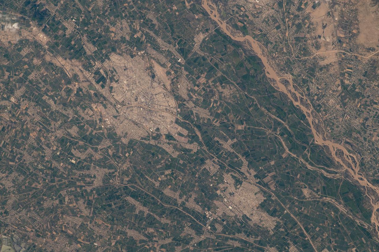 iss067e212667 (July 31, 2022) --- The Uzbekistan cities of Urgench and Xonqa near the Amu Darya, a major river in Central Asia, are pictured from the International Space Station as it orbited 259 miles above.