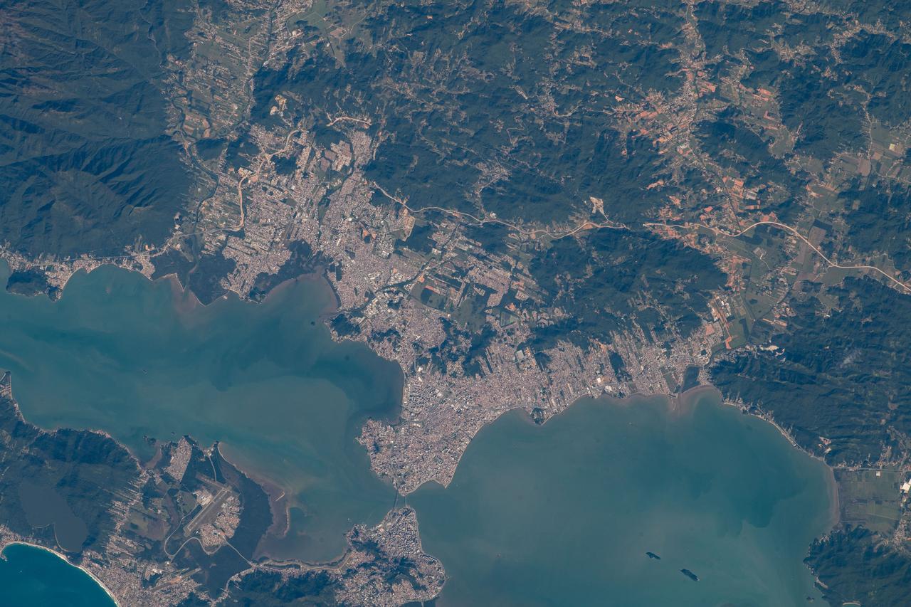 iss067e213656 (July 31, 2022) --- The cities of San Jose (top) and Floriana (bottom) in Brazil are bridged together in between the North and South Bays in this photograph from the International Space Station as it orbited 264 miles above.