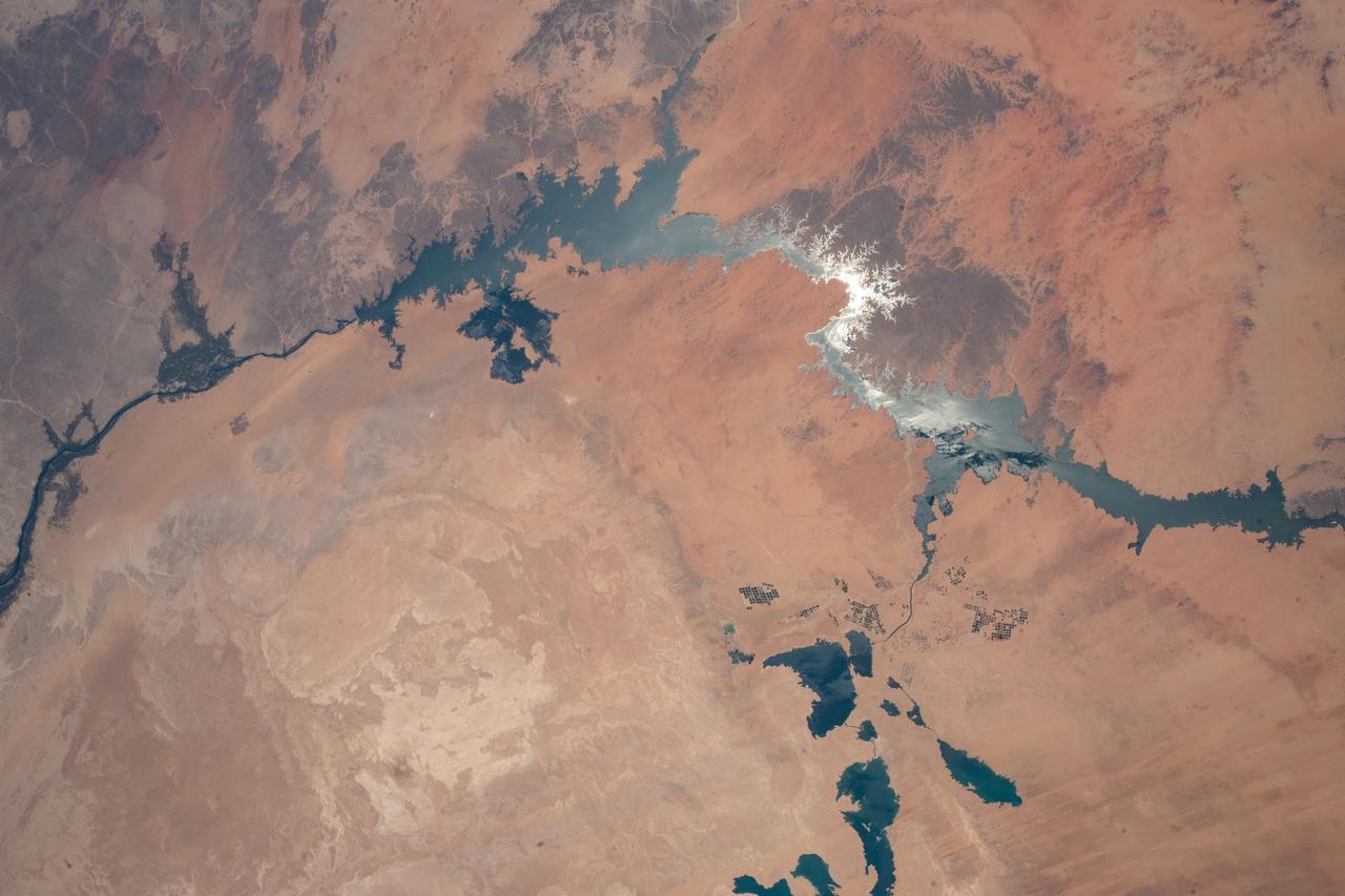 iss067e222958 (Aug. 3, 2022) --- The sun's glint beams off Lake Nasser in Southern Egypt in this photograph from the International Space Station as it orbited 257 miles above.
