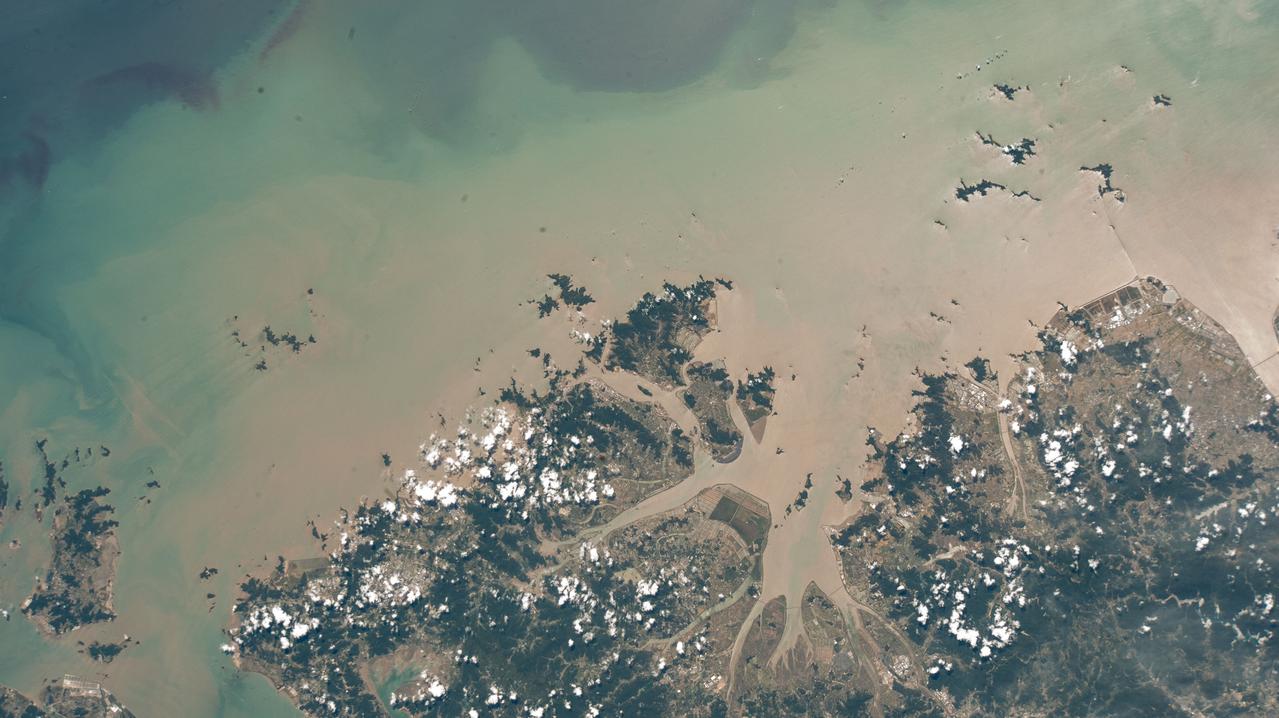 iss067e238165 (Aug. 5, 2022) --- Taizhuo, China, and its surrounding suburbs on the East China Sea are pictured from the International Space Station as it orbited 258 miles above the east coast of the Asian nation.