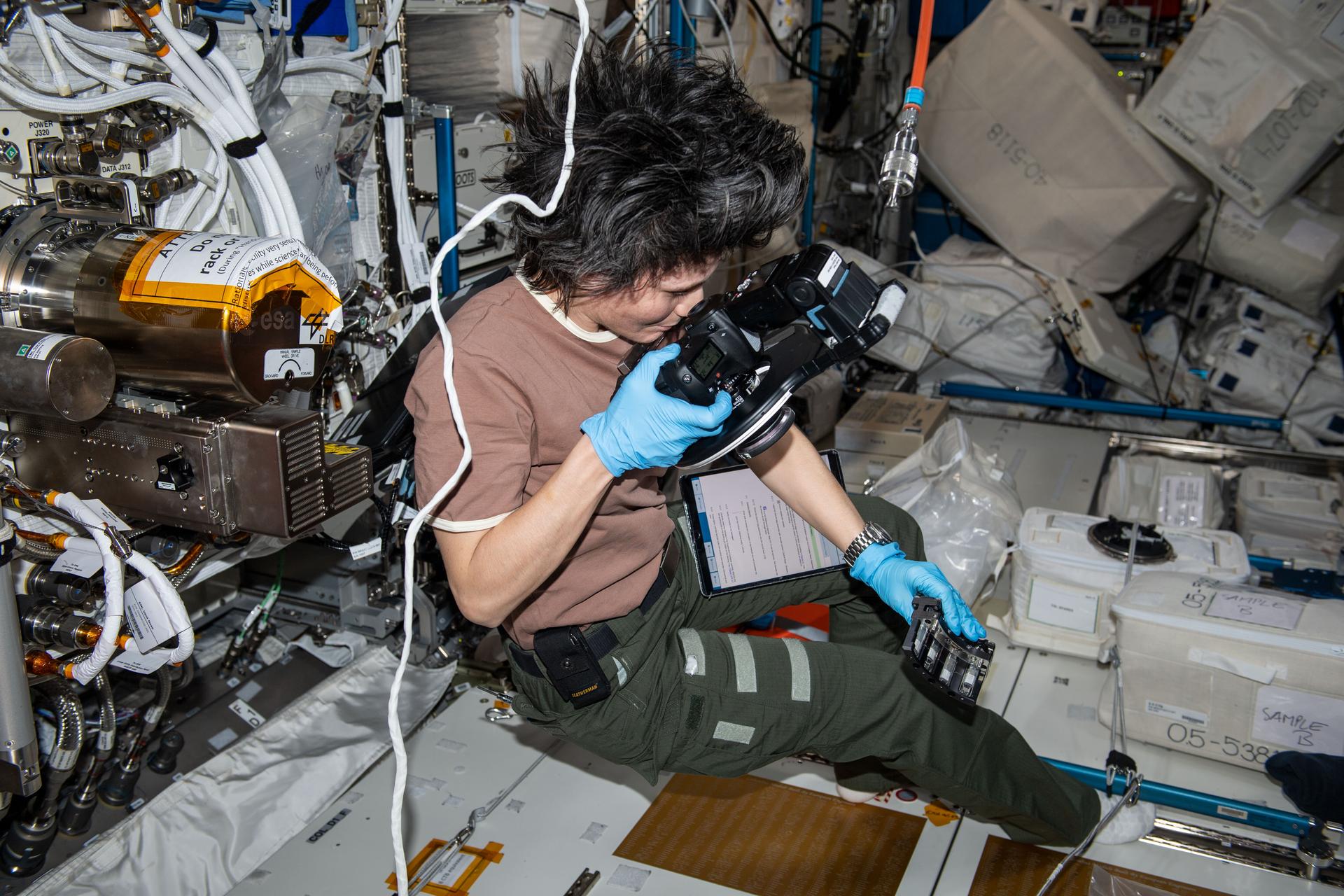 ESA (European Space Agency) astronaut and Expedition 67 Flight Engineer Samantha Cristoforetti photographs and exchanges samples for the Fluids Science Laboratory Soft Matter Dynamics space physics experiment aboard the Intenational Space Station's Columbus laboratory module. The microgravity environment enables the observation of "wet" foams and the study of rearrangement phenomena, such as coarsening and coalescence, disentangled from drainage issues caused by Earth's gravity. Results may benefit Earth and space industries.