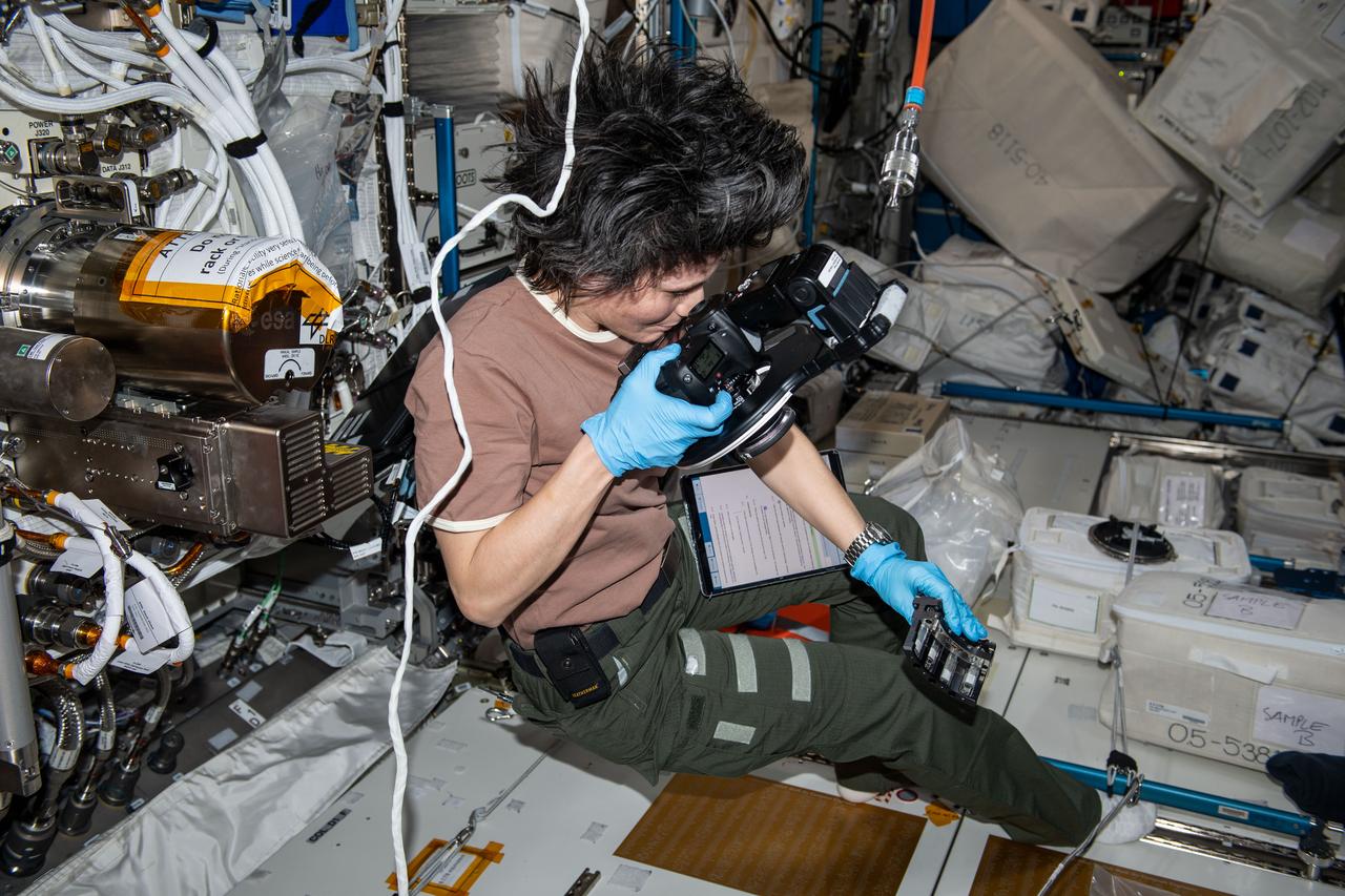 iss067e253397 (Dec. 2, 2024) --- ESA (European Space Agency) astronaut and Expedition 67 Flight Engineer Samantha Cristoforetti photographs and exchanges samples for the Fluids Science Laboratory Soft Matter Dynamics space physics experiment aboard the Intenational Space Station's Columbus laboratory module. The microgravity environment enables the observation of "wet" foams and the study of rearrangement phenomena, such as coarsening and coalescence, disentangled from drainage issues caused by Earth's gravity. Results may benefit Earth and space industries.