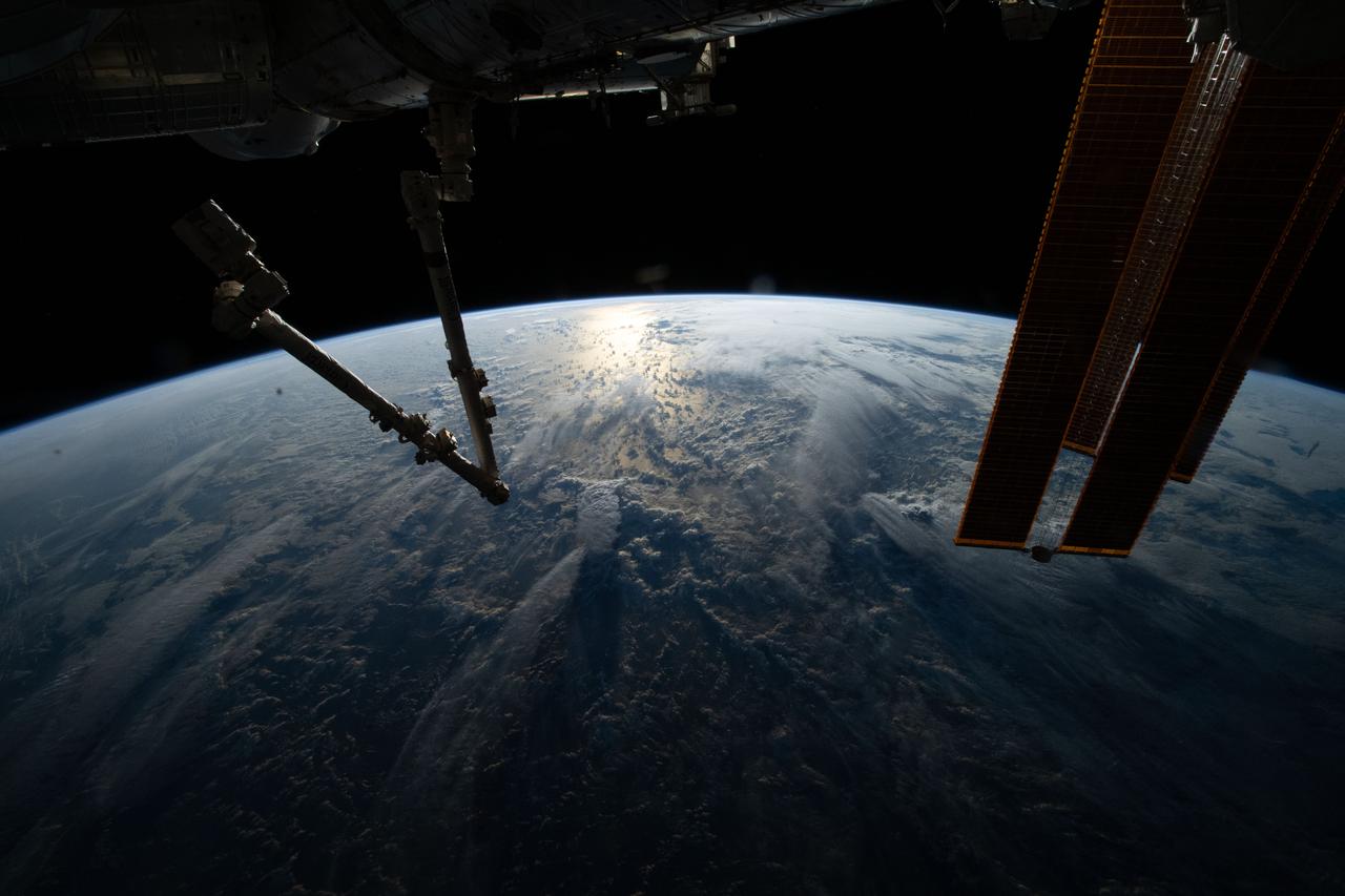 iss067e265002 (Aug. 13, 2022) --- The sun's glint beams off the Indian Ocean in this photograph from the International Space Station as it soared 260 miles above during an early morning orbital trek off the coast of Somalia.