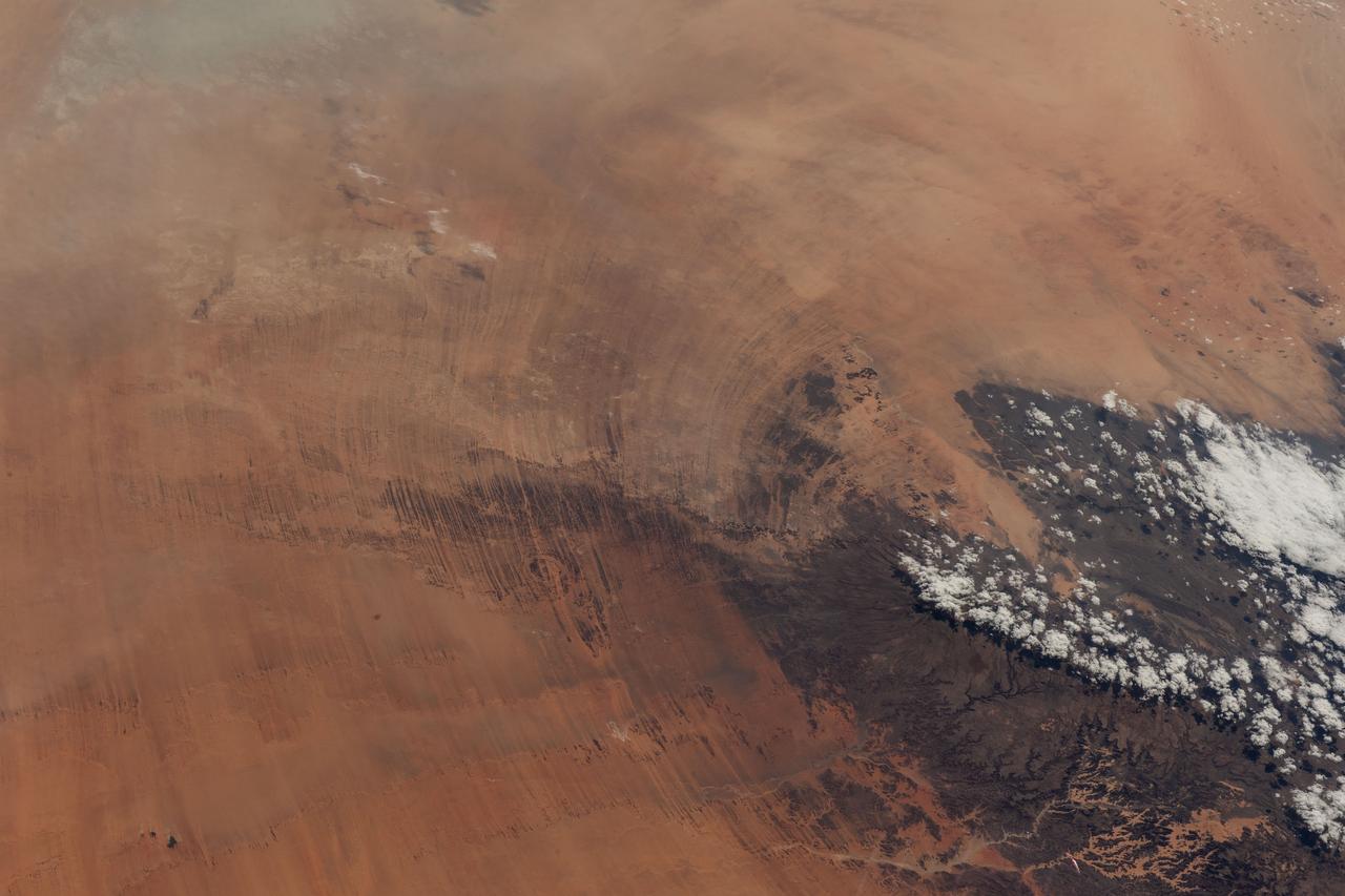 iss067e270532 (Aug. 18, 2022) --- A portion of the Tibesti Mountains (lower right), in the Saharan region of the nation of Chad, is pictured from the International Space Station as it orbited 257 miles above the African continent.