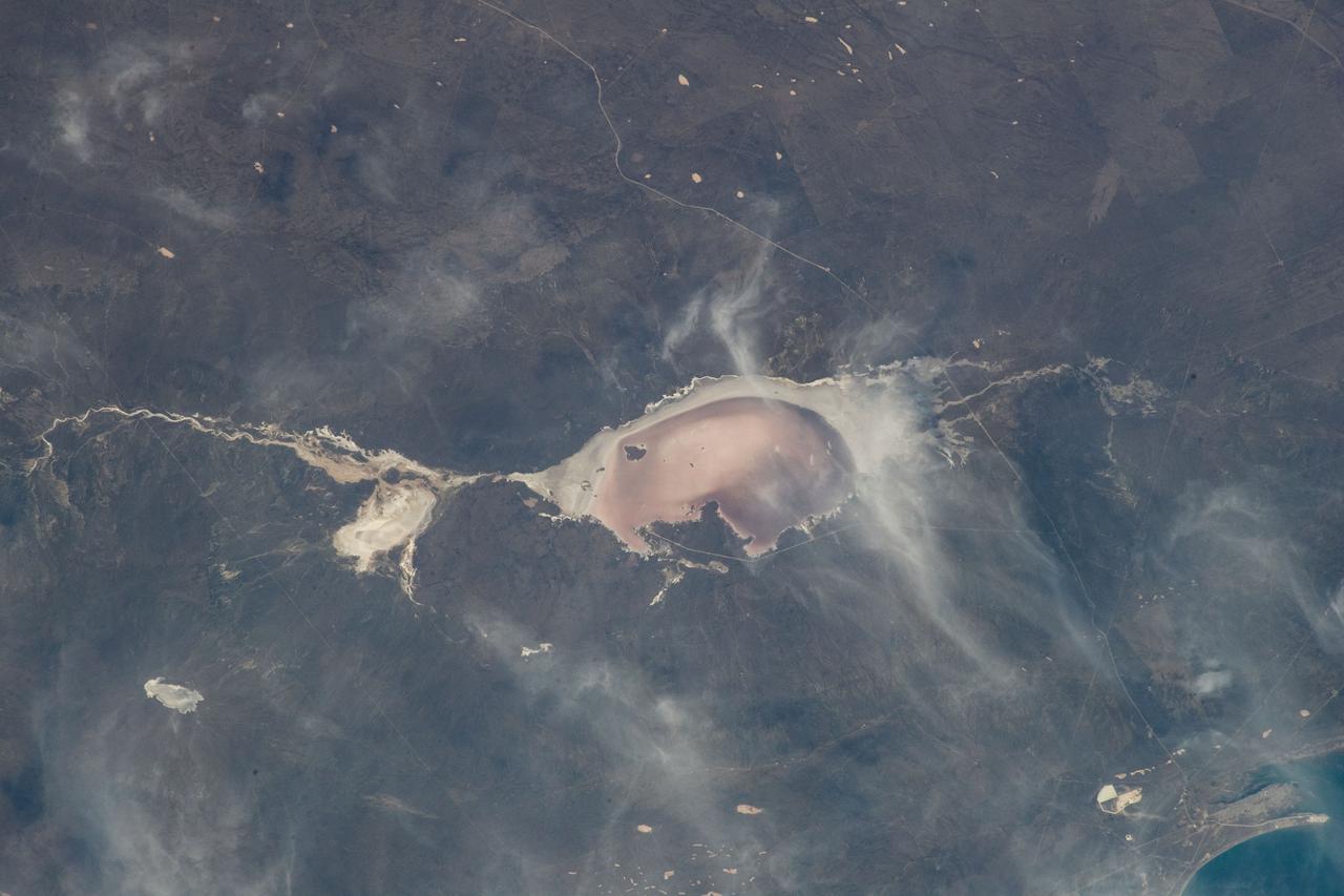 iss067e301712 (Aug. 30, 2022) --- Las Salinas del Gualicho, the third largest salt flat in the world and approximately 240 feet below sea level, is pictured from the International Space Station as it orbited 266 miles above Argentina.